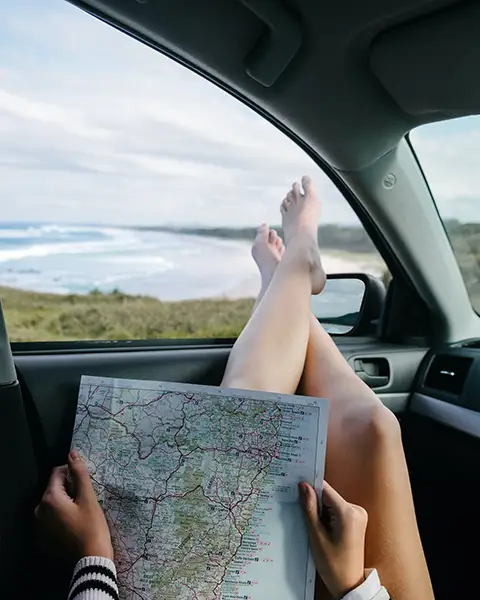 road trip with map in car